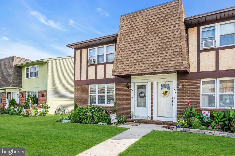 1964 East Oak Road, Unit K4 Vineland, NJ 08361 - Photo 4 of 25 a front view of a house with a yard