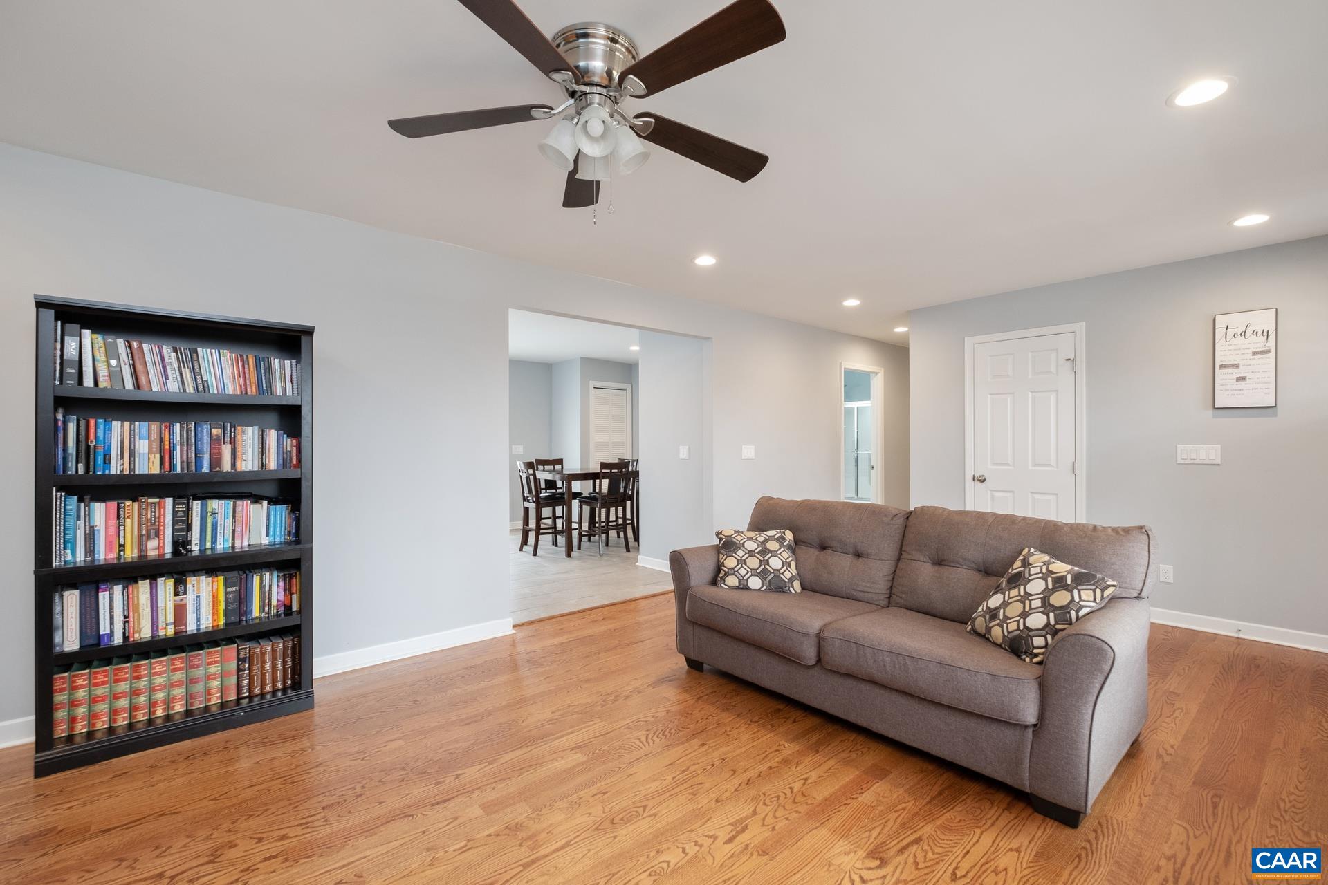 237 Jonquil Road Ruckersville, VA 22968 - Photo 8 of 28 a living room with furniture and a book shelf