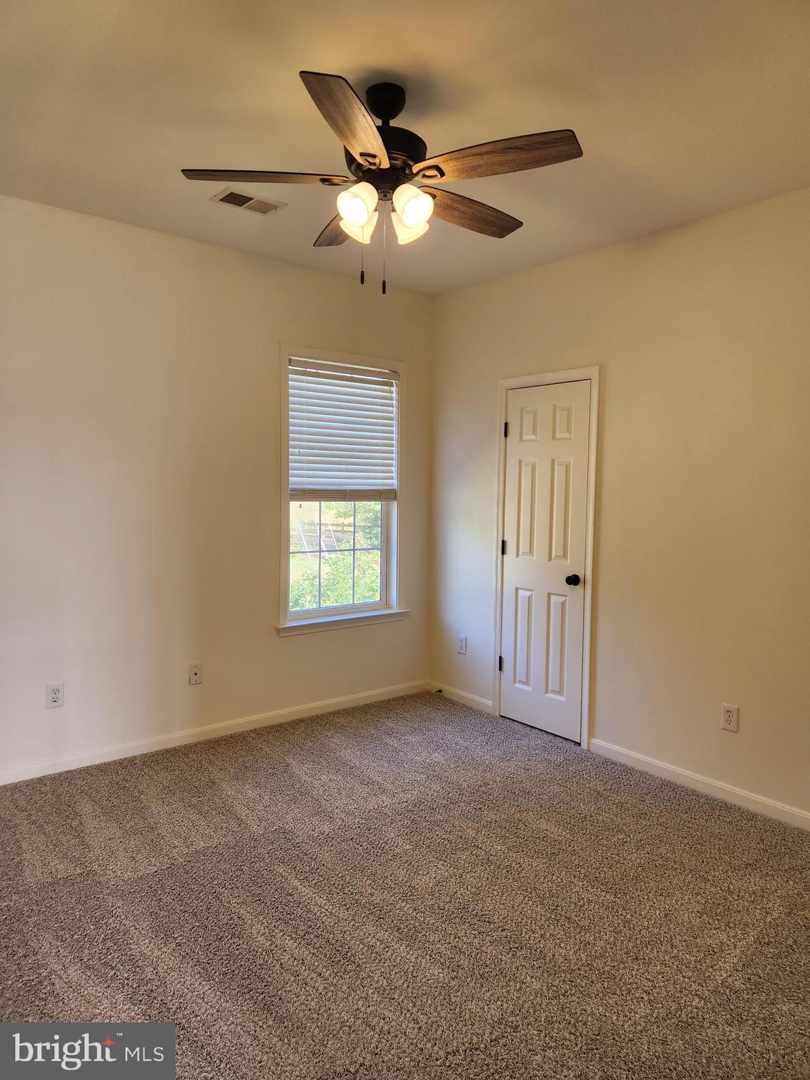 15117 Montanus Drive Culpeper, VA 22701 - Photo 20 of 27 an empty room with windows and fan