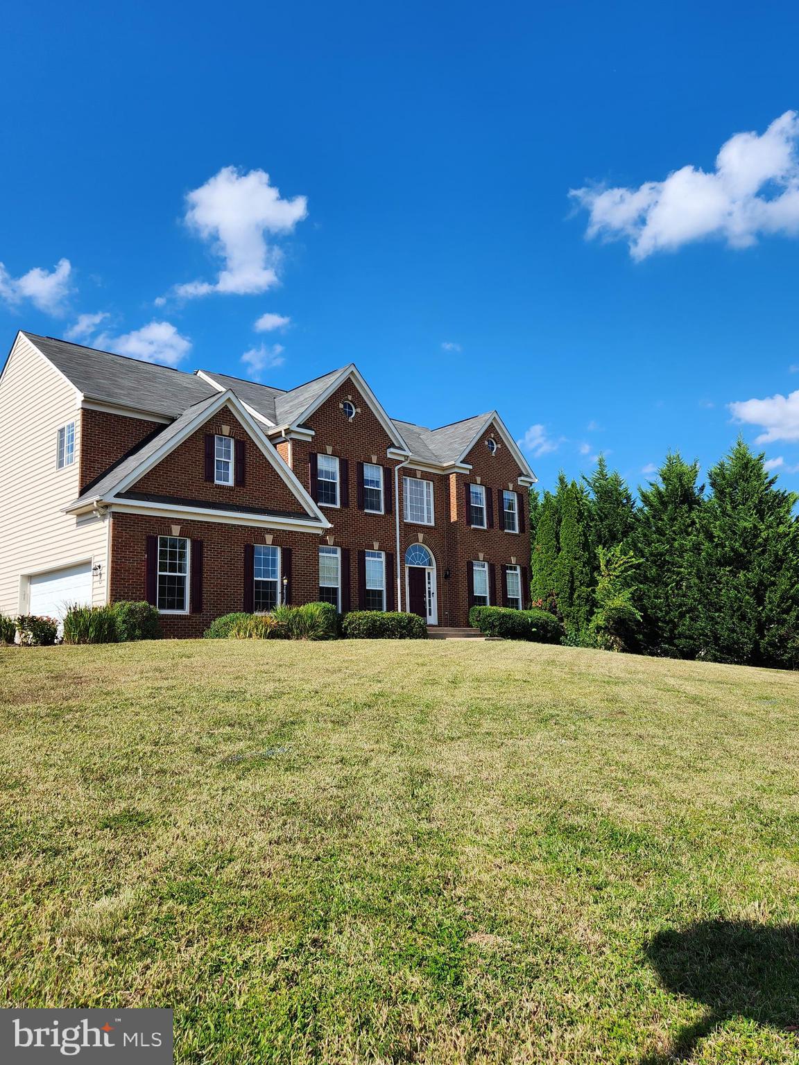 15117 Montanus Drive Culpeper, VA 22701 - Photo 2 of 27 a front view of a house with garden