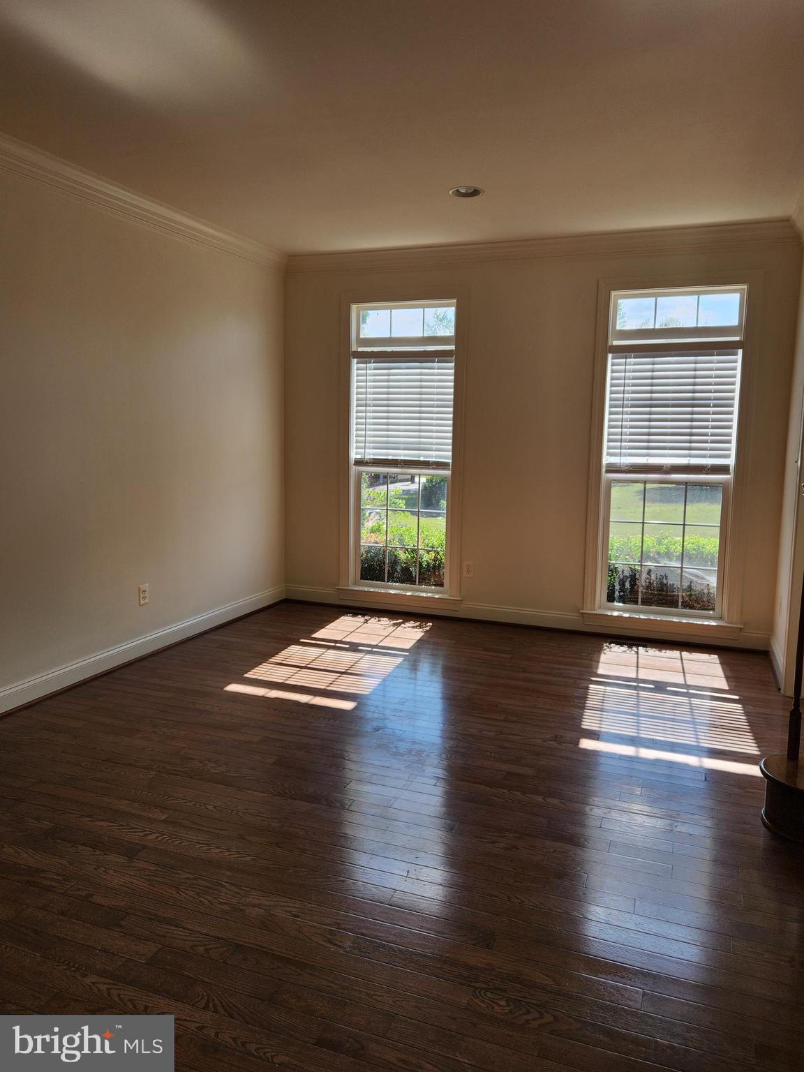 15117 Montanus Drive Culpeper, VA 22701 - Photo 5 of 27 a view of empty room with wooden floor and fan