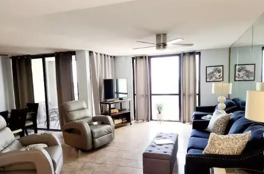 a living room with furniture and a flat screen tv