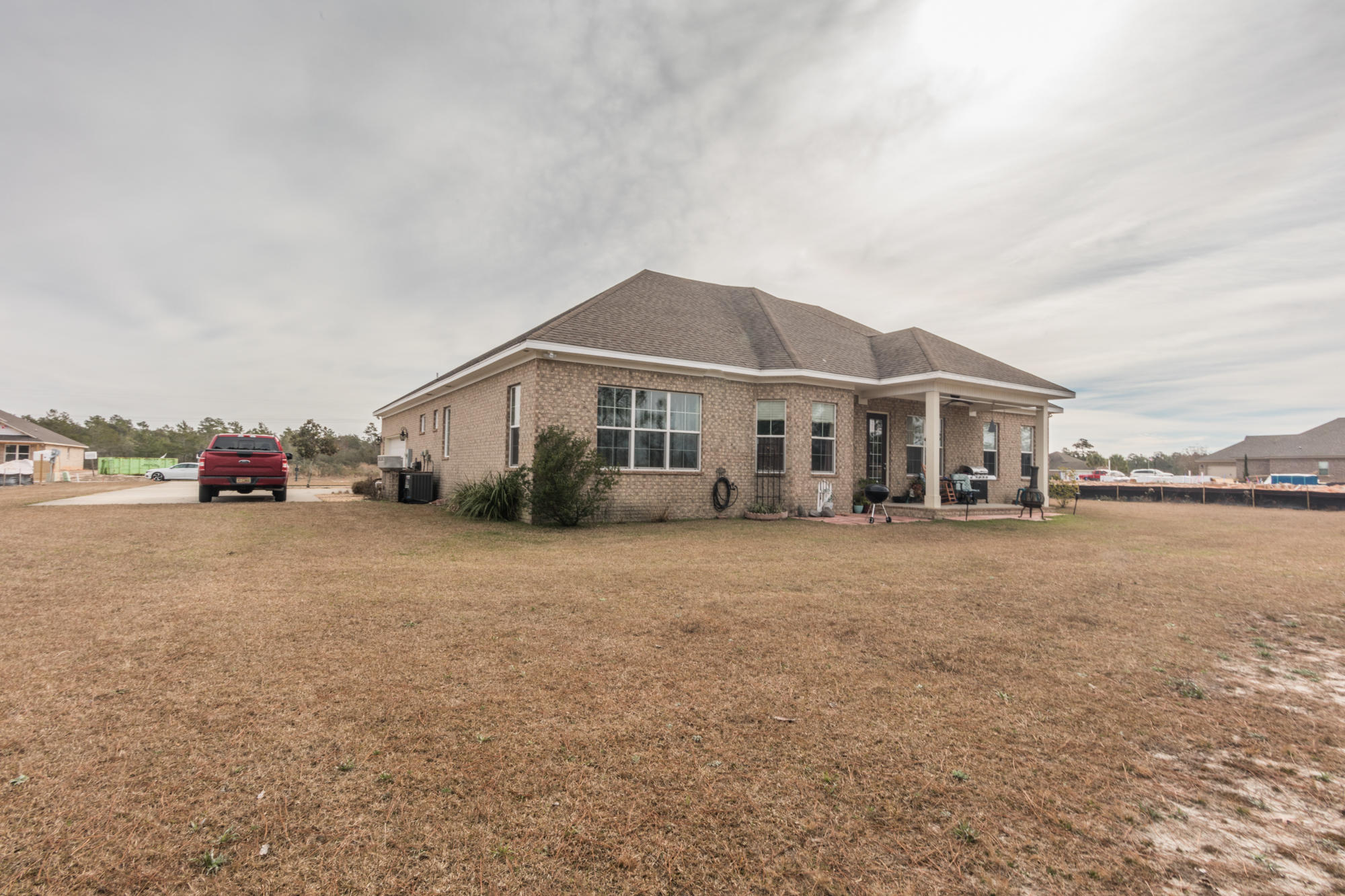 331 Brushed Dunes Circle Freeport, FL 32439 - Photo 13 of 60 a car parked in front of white house