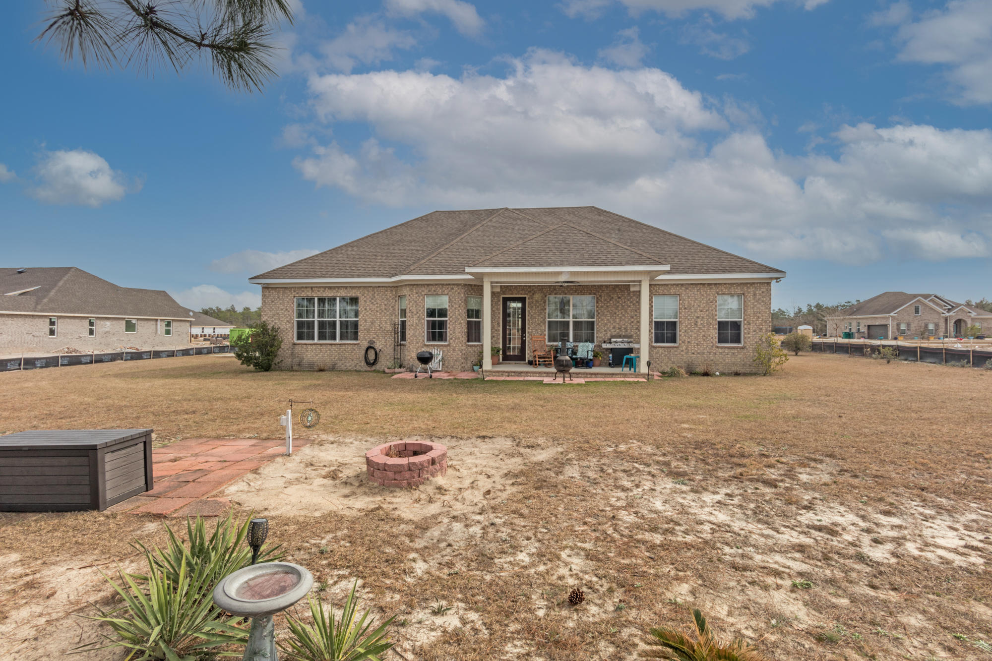 331 Brushed Dunes Circle Freeport, FL 32439 - Photo 17 of 60 a view of a house with swimming pool and a yard