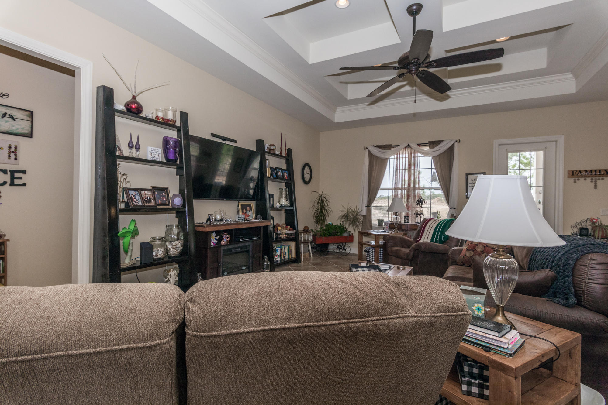 331 Brushed Dunes Circle Freeport, FL 32439 - Photo 27 of 60 a living room with furniture and a flat screen tv