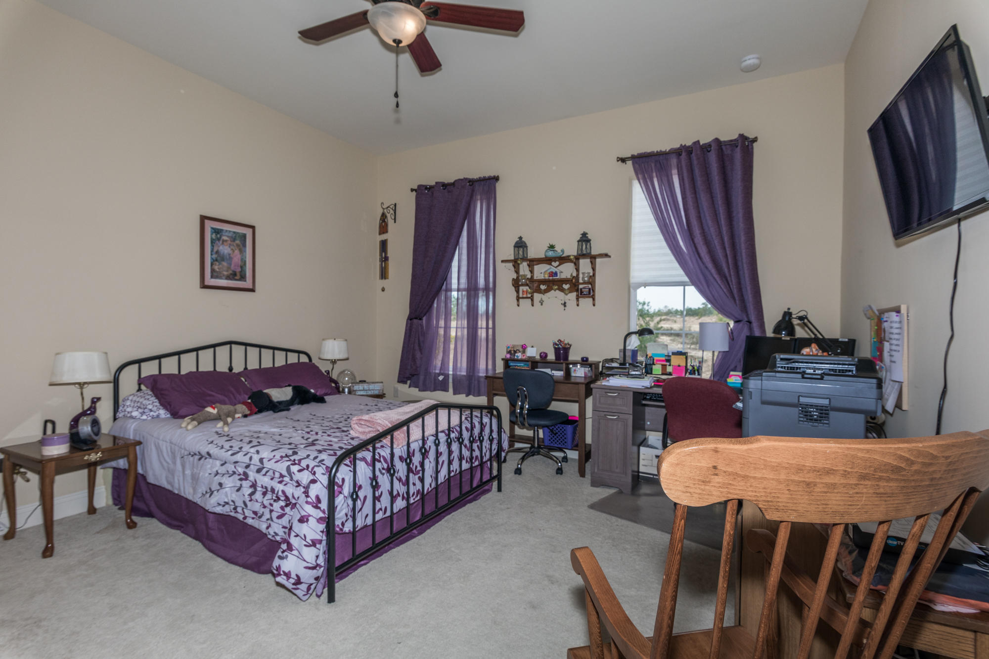 331 Brushed Dunes Circle Freeport, FL 32439 - Photo 29 of 60 a bedroom with a bed and a flat screen tv