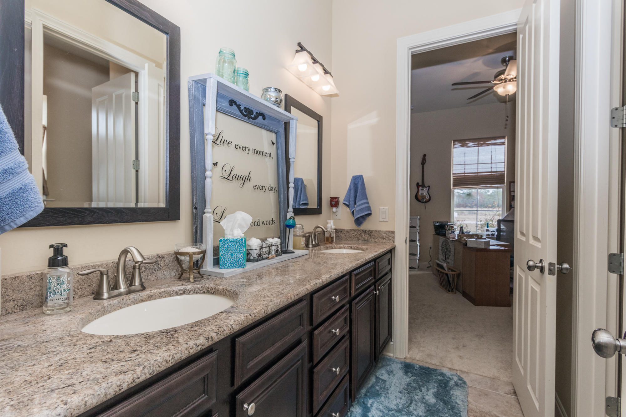 331 Brushed Dunes Circle Freeport, FL 32439 - Photo 30 of 60 a bathroom with a granite countertop sink and a mirror