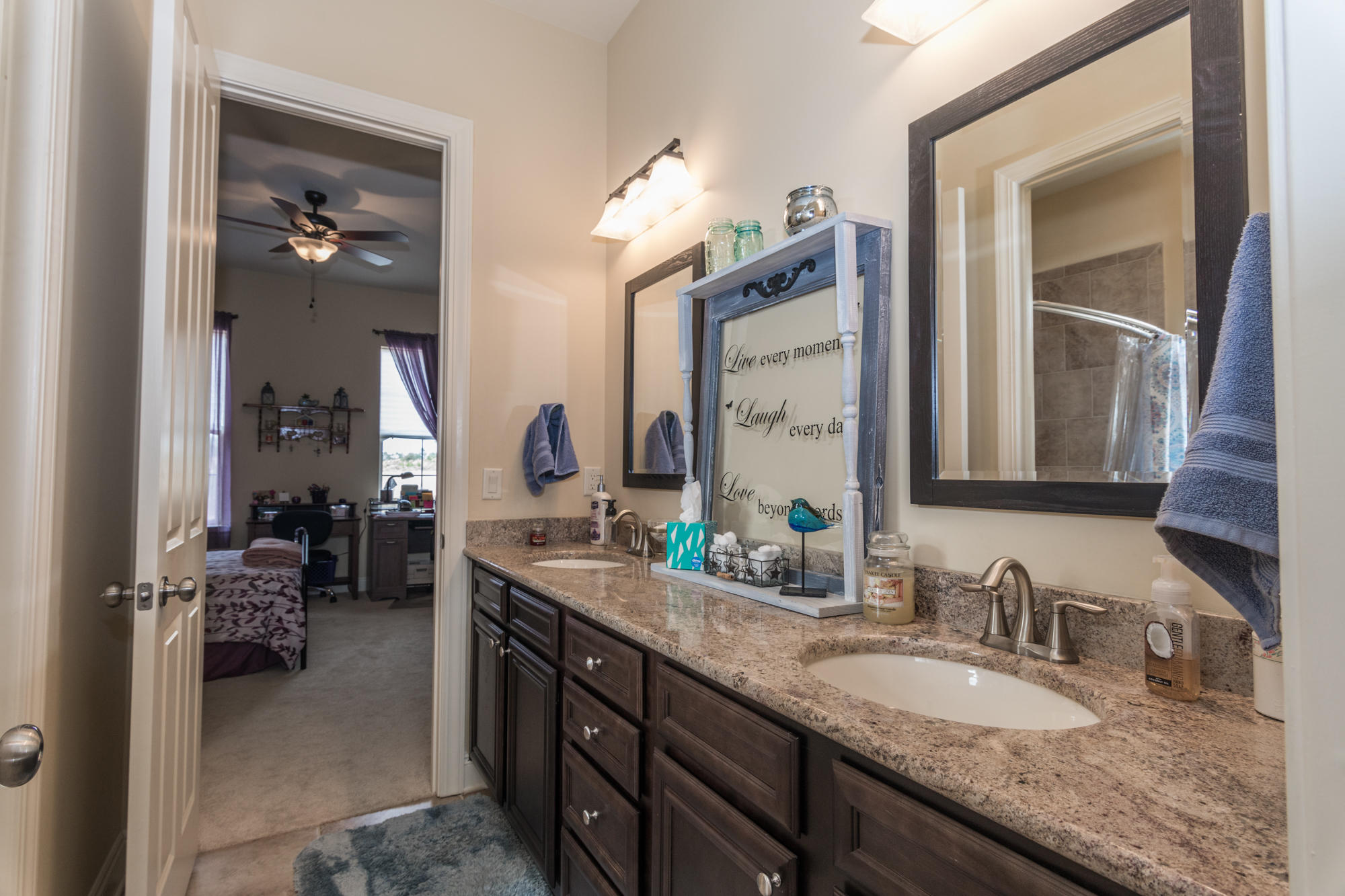 331 Brushed Dunes Circle Freeport, FL 32439 - Photo 31 of 60 a bathroom with a granite countertop double vanity sink and a mirror