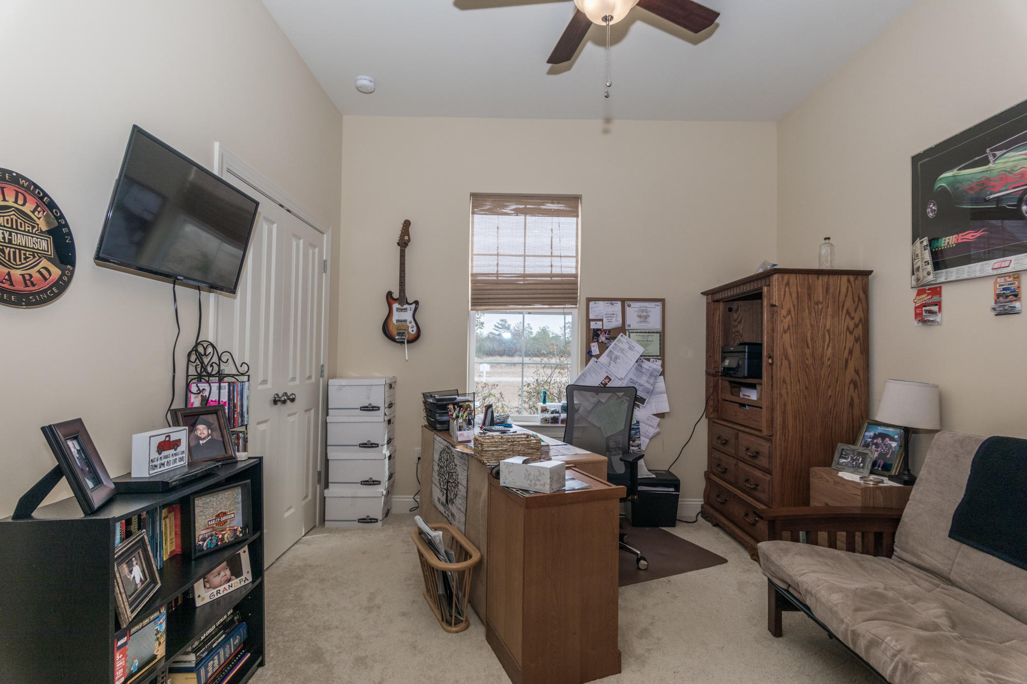 331 Brushed Dunes Circle Freeport, FL 32439 - Photo 33 of 60 a living room with furniture a flat screen tv and a window