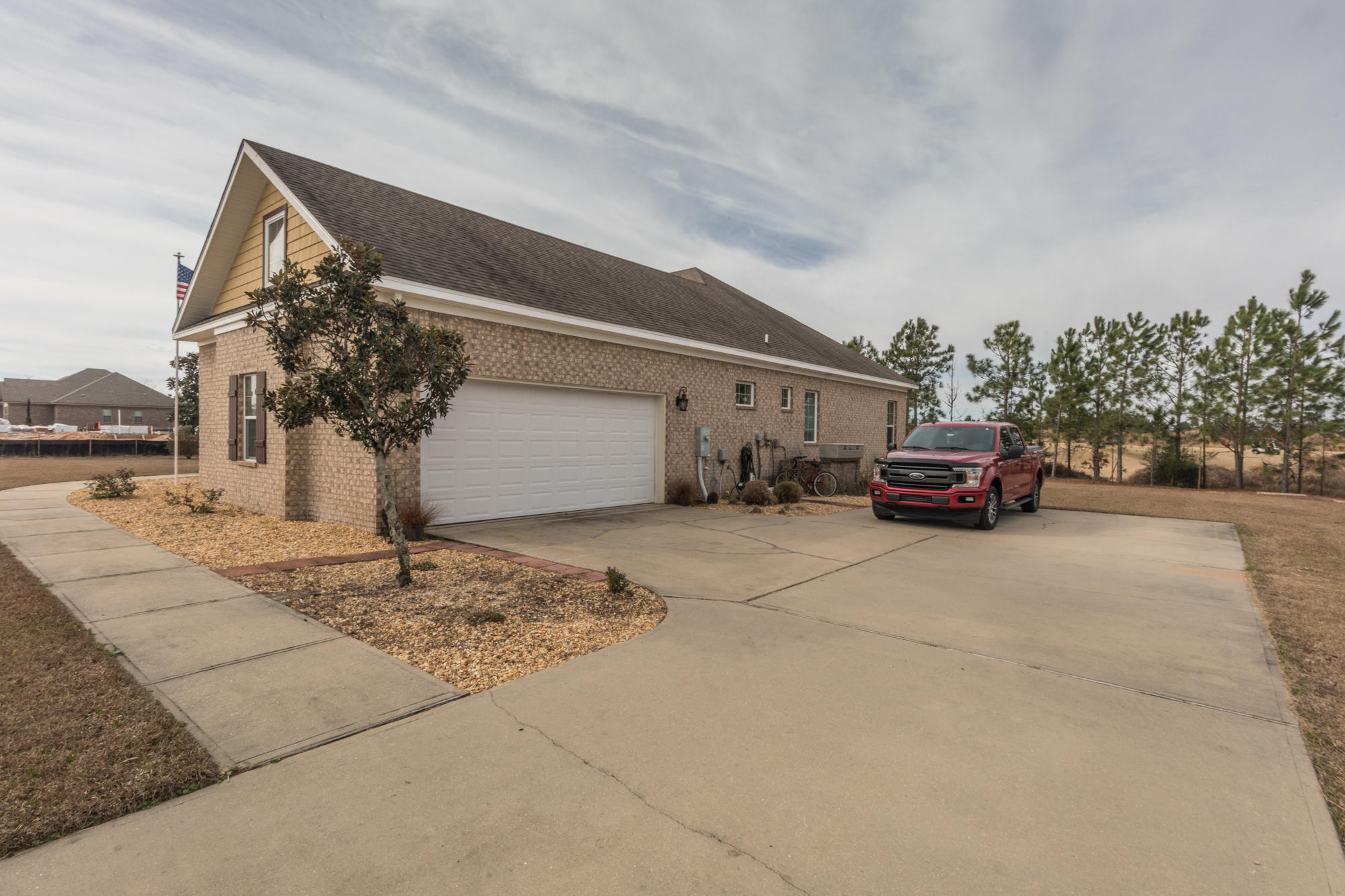 331 Brushed Dunes Circle Freeport, FL 32439 - Photo 55 of 60 a car parked in front of a house