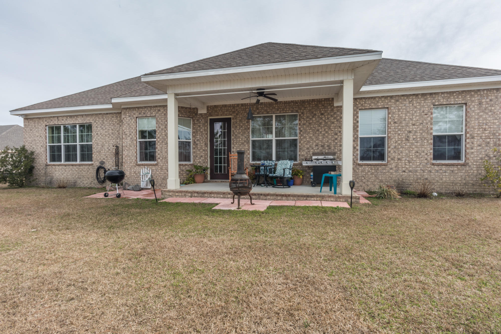 331 Brushed Dunes Circle Freeport, FL 32439 - Photo 57 of 60 front view of a house with a patio
