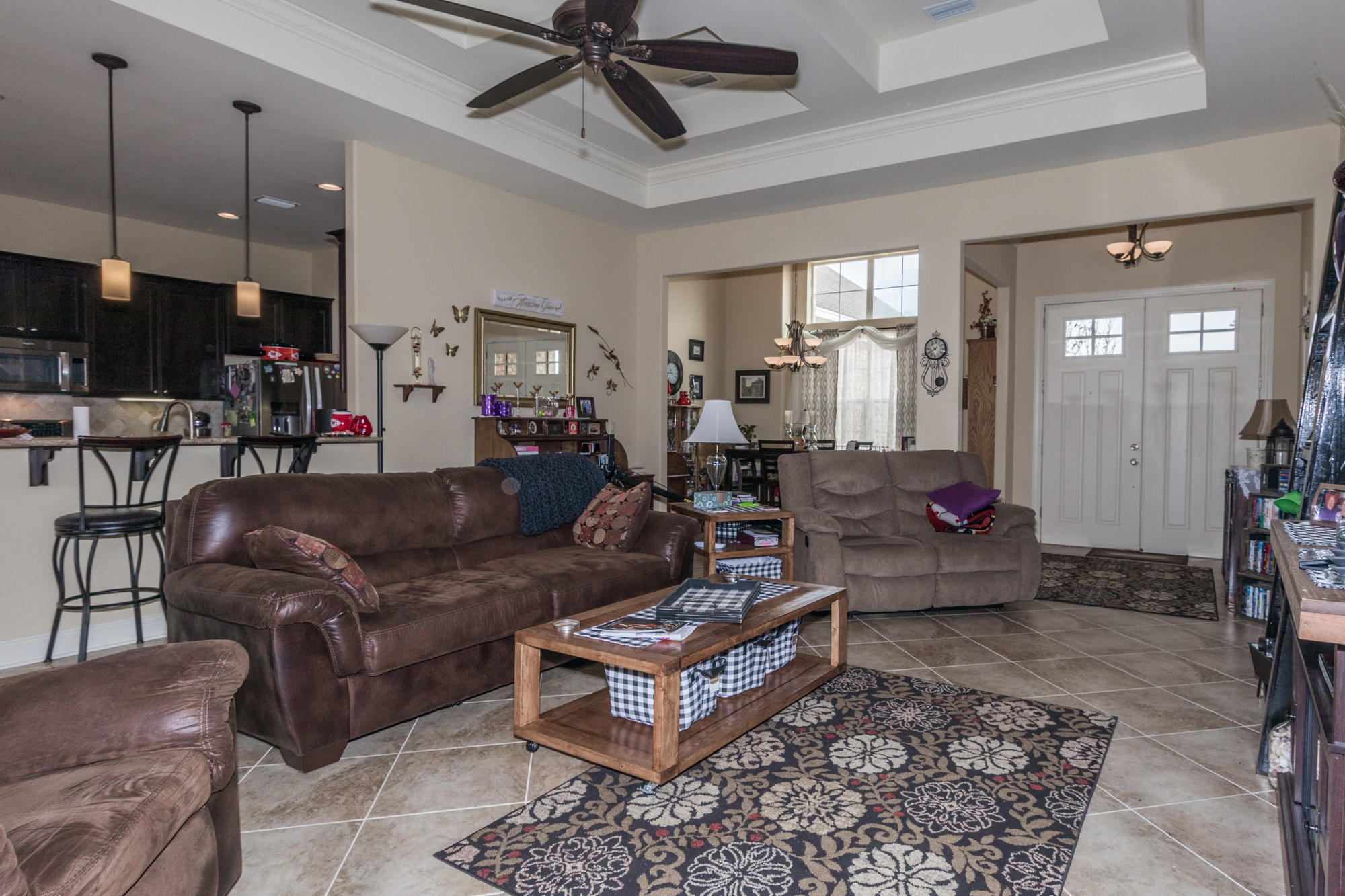 331 Brushed Dunes Circle Freeport, FL 32439 - Photo 6 of 60 a living room with furniture and a chandelier