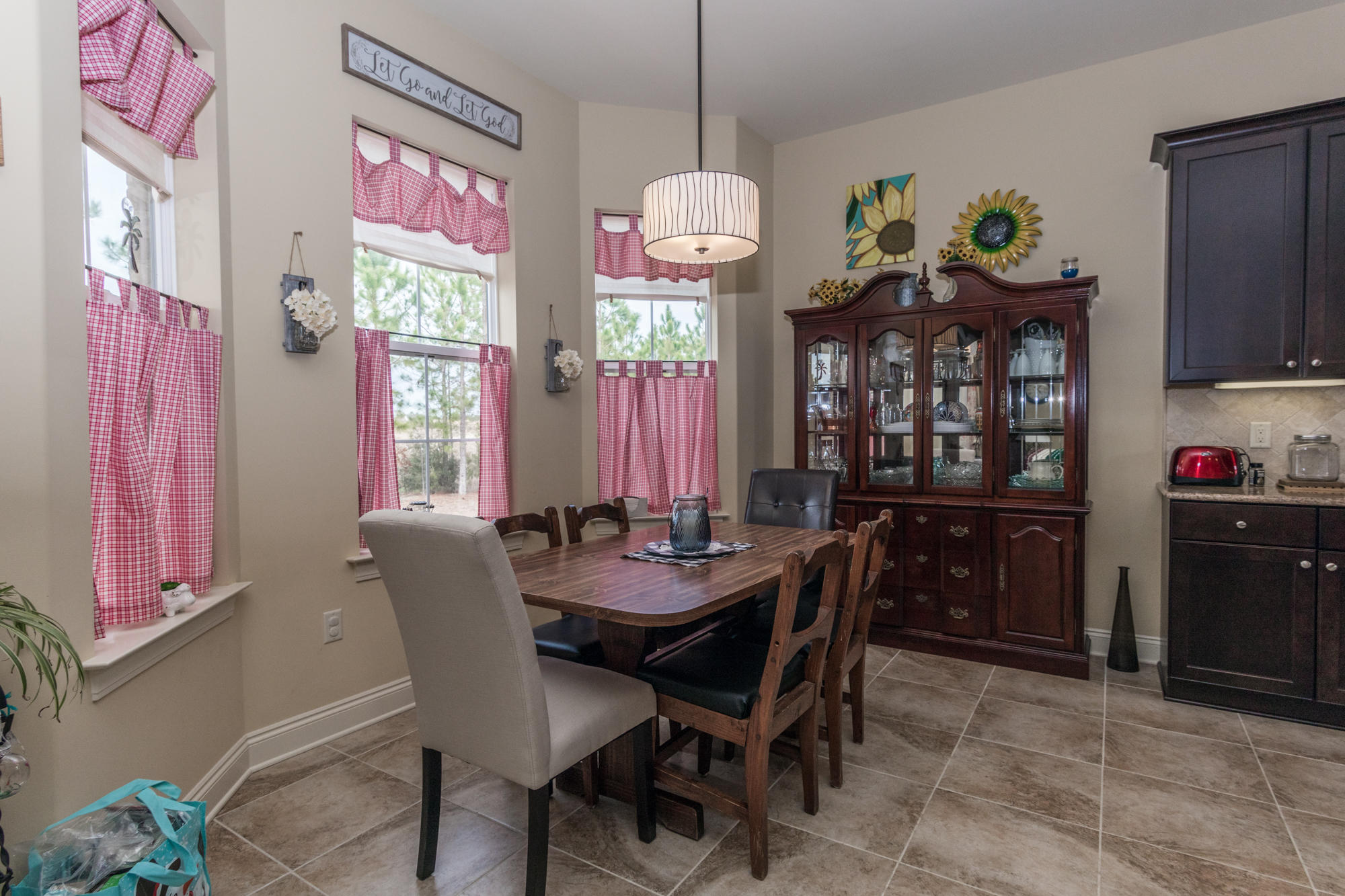 331 Brushed Dunes Circle Freeport, FL 32439 - Photo 7 of 60 a view of a dining room with furniture and chandelier