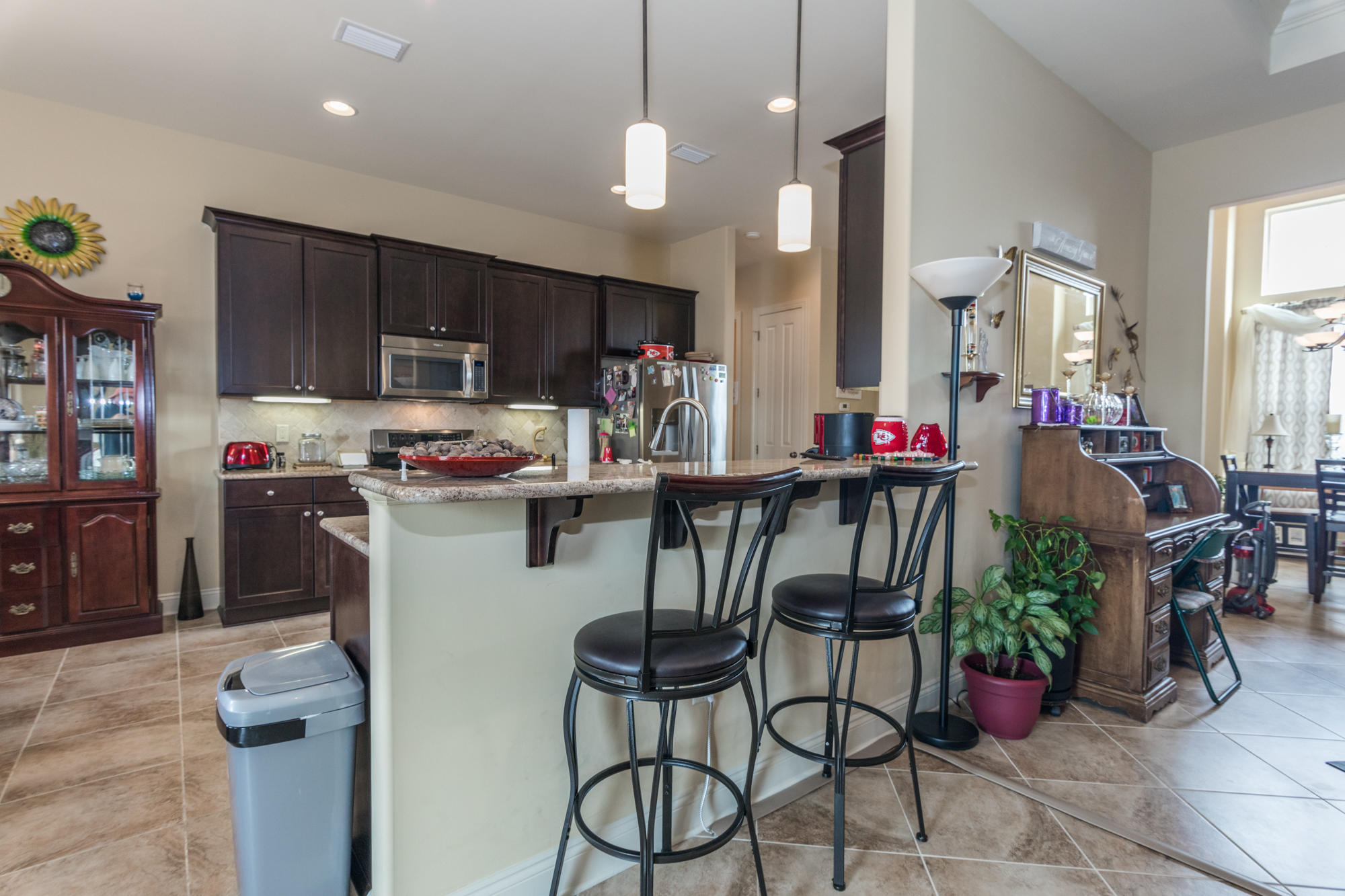 331 Brushed Dunes Circle Freeport, FL 32439 - Photo 8 of 60 a kitchen with a dining table cabinets and appliances