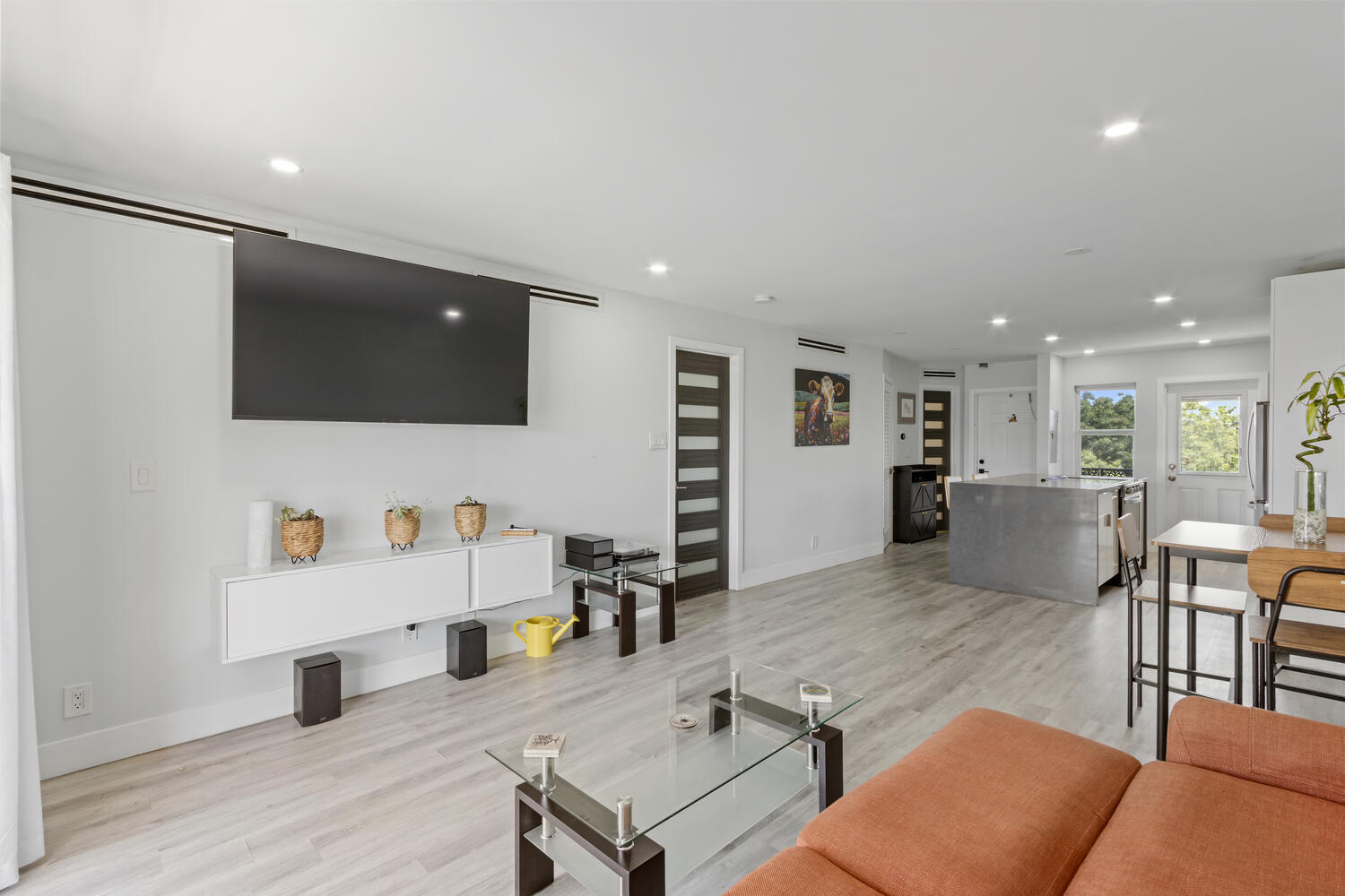 2871 North Ocean Boulevard, Unit V443 Boca Raton, FL 33431 - Photo 8 of 49 a living room with furniture and a flat screen tv