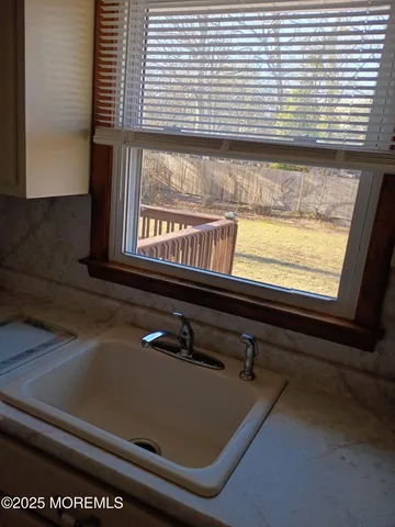 a kitchen with stainless steel appliances a refrigerator sink and cabinets