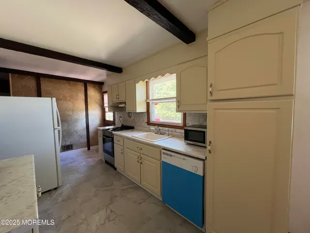 a utility room with washer and dryer