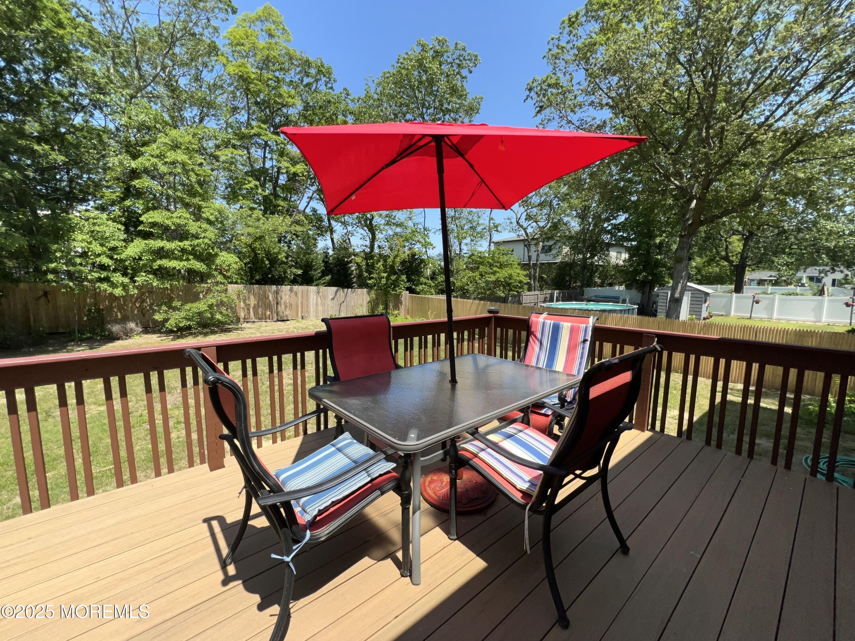 1595 Forge Pond Road Brick, NJ 08724 - Photo 21 of 35 a view of balcony with wooden floor and outdoor seating