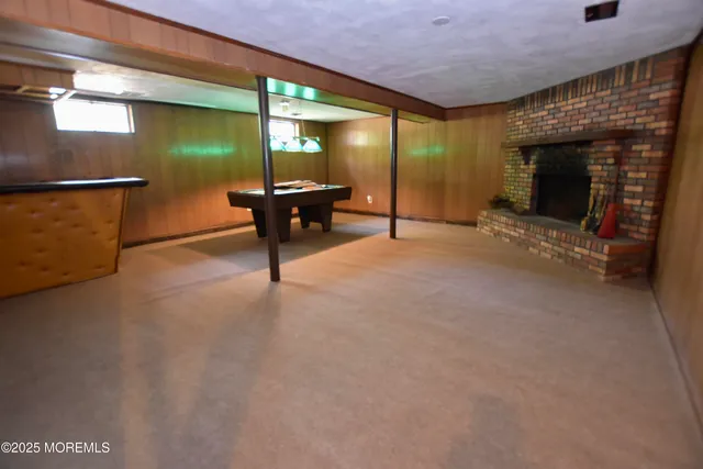 a view of water heater room with fireplace