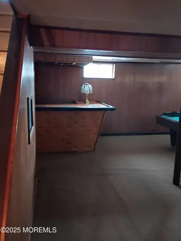 a view of an empty room with a wooden door