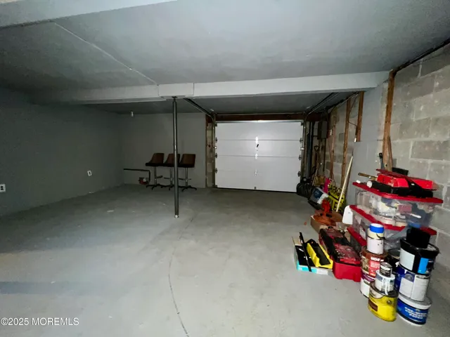 a view of a big room with air conditioner duct and materials on floor