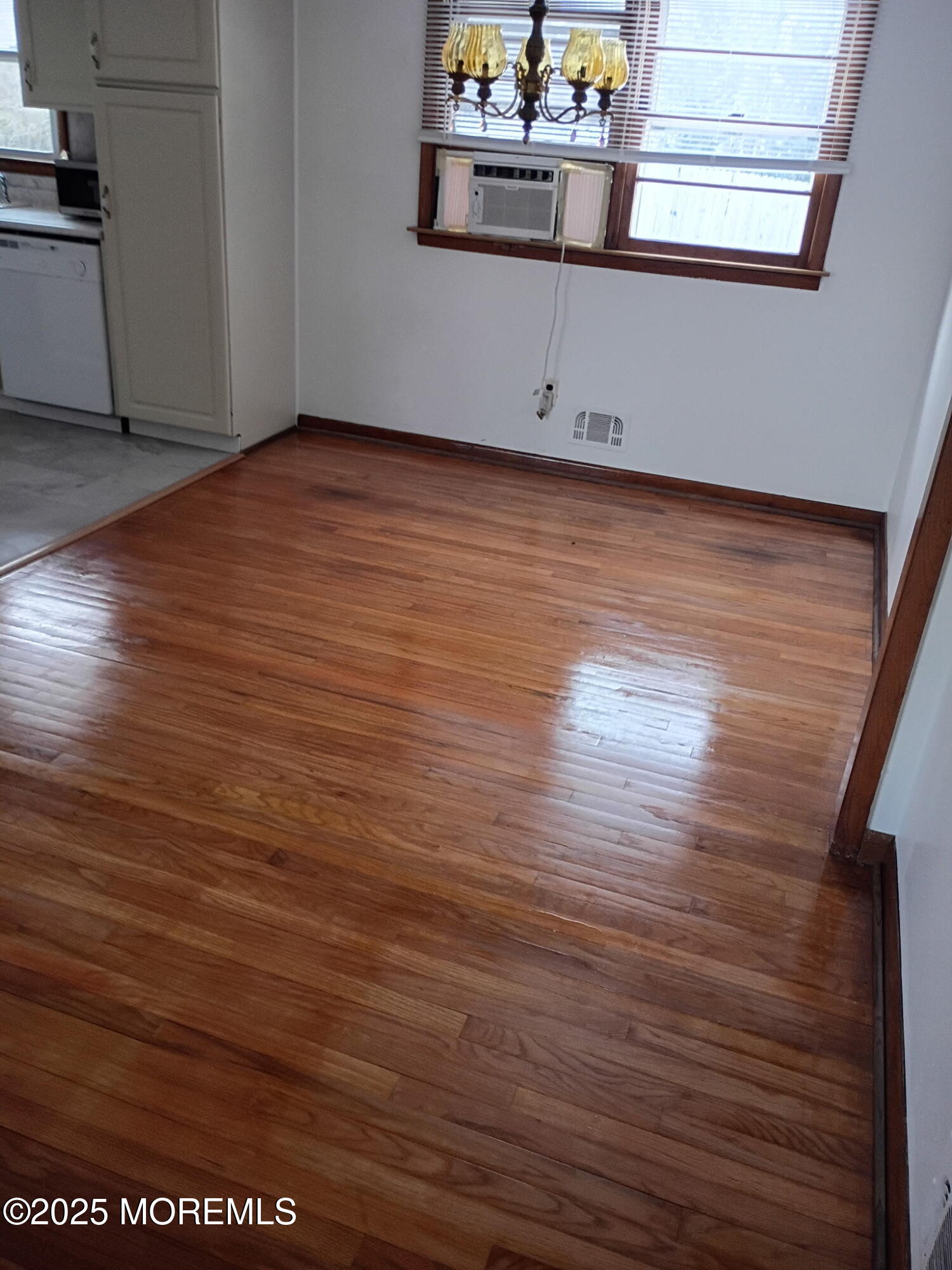 1595 Forge Pond Road Brick, NJ 08724 - Photo 3 of 35 a view of wooden floor and windows in a room