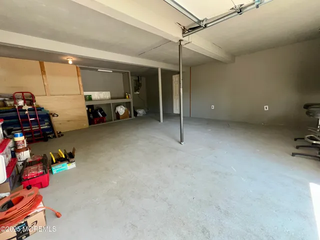 a front view of a house with a yard and a garage