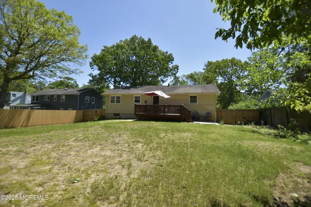 a view of a back yard of the house