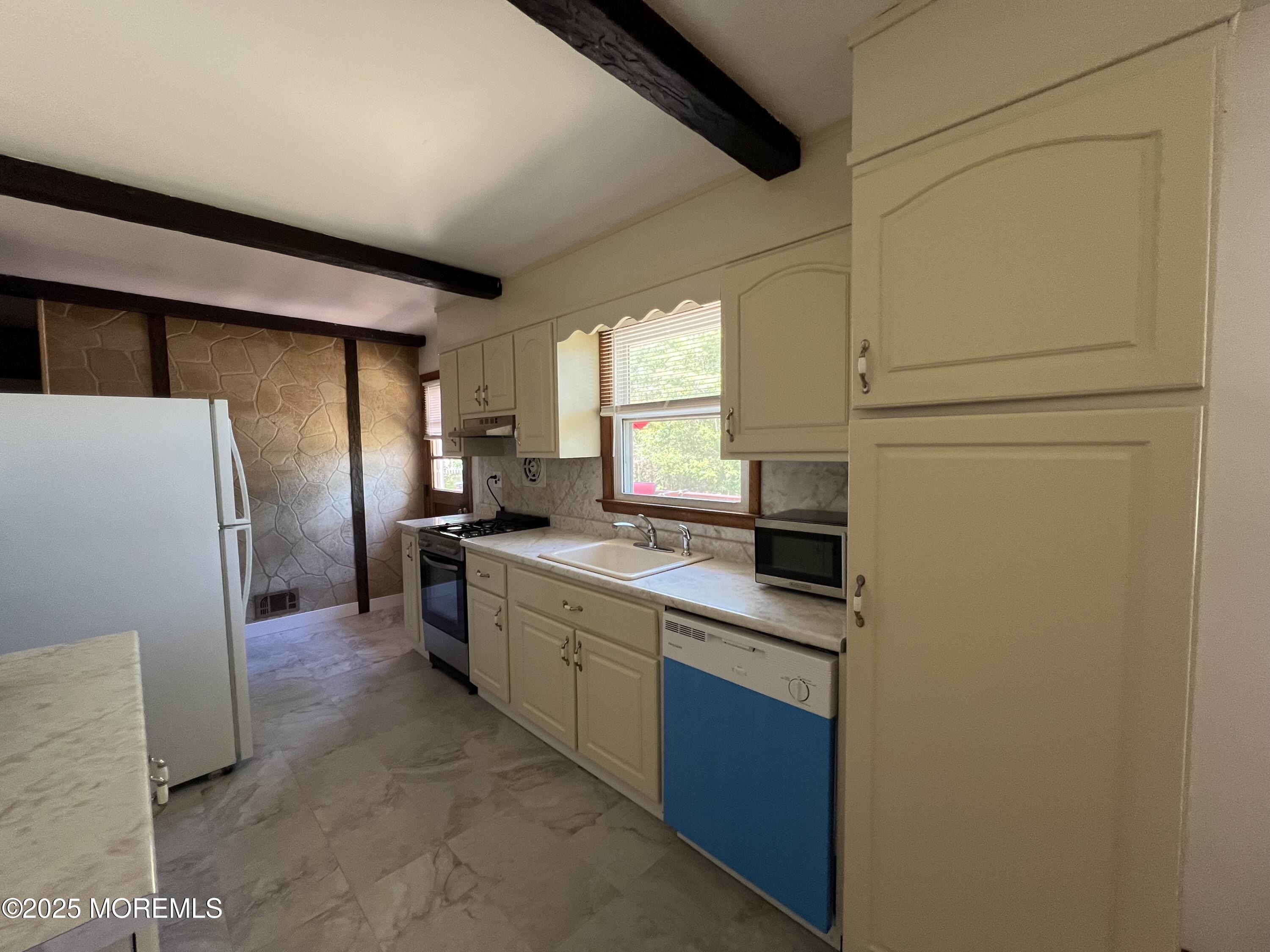 1595 Forge Pond Road Brick, NJ 08724 - Photo 7 of 35 a kitchen with stainless steel appliances a refrigerator sink and cabinets