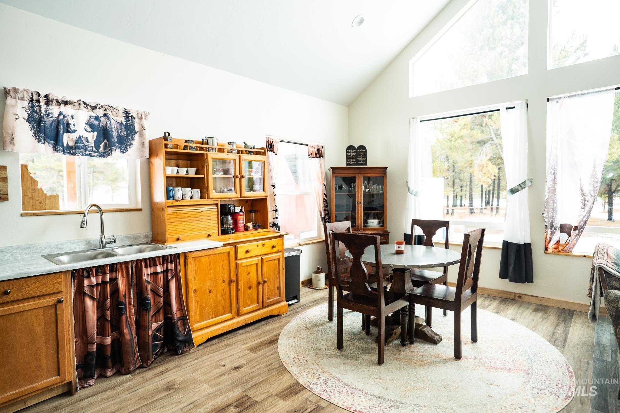 22 West Prospectors Drive Cascade, ID 83611 - Photo 24 of 29 Dining area with light wood-type flooring and high vaulted ceiling