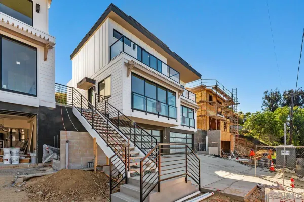 a view of a house with iron stairs
