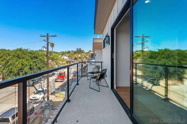 a view of a balcony with chairs