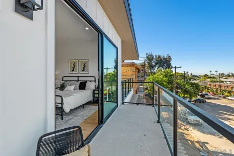 a balcony with view of living room