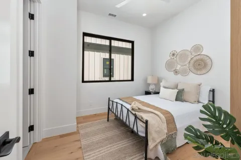 a bedroom with a bed and a window