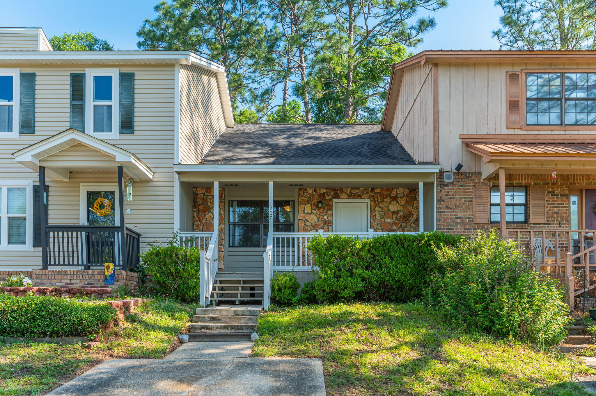 a front view of a house with garden