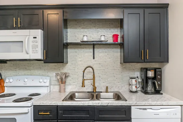 a kitchen with a sink and a stove