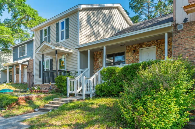 front view of a house with a small yard