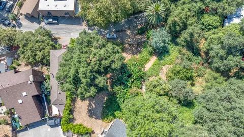 an aerial view of residential house with outdoor space