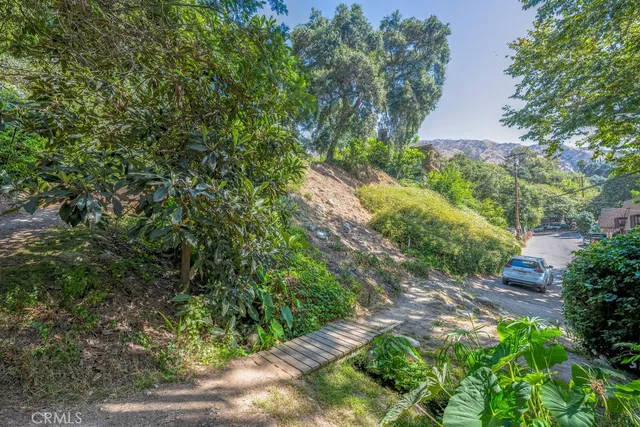 a backyard of a house with lots of green space