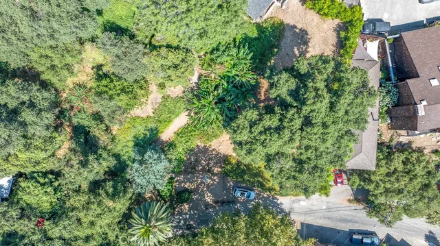 an aerial view of a house with yard