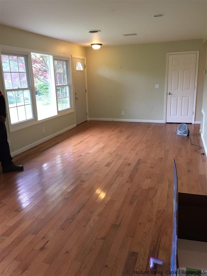 21 Broadview Road Woodstock, NY 12498 - Photo 8 of 10 an empty room with wooden floor and windows