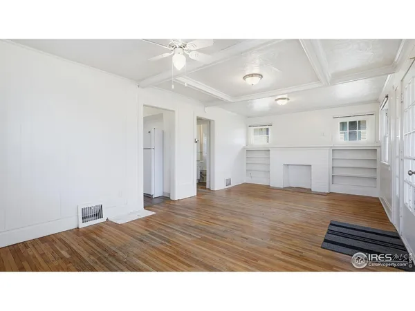a room with a bed and a cabinets