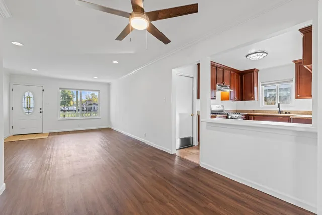 a view of an empty room with windows