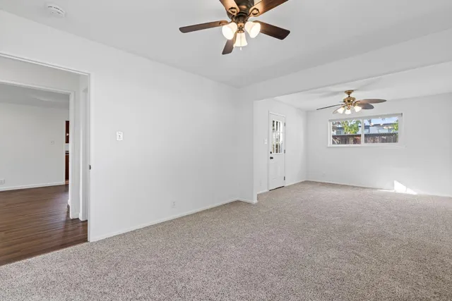 a backyard of a house with wooden fence