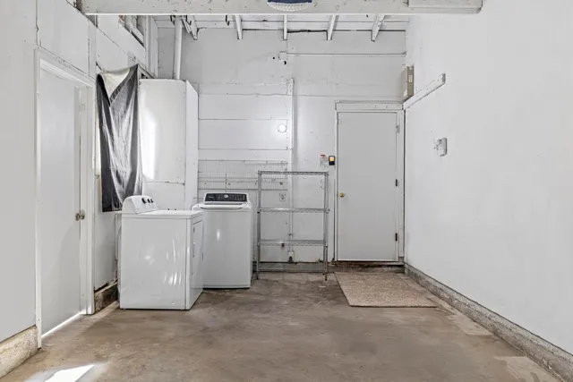 a front view of house with yard and trees in the background