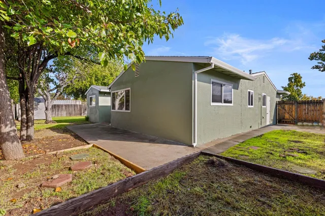 an aerial view of house with pool and yard