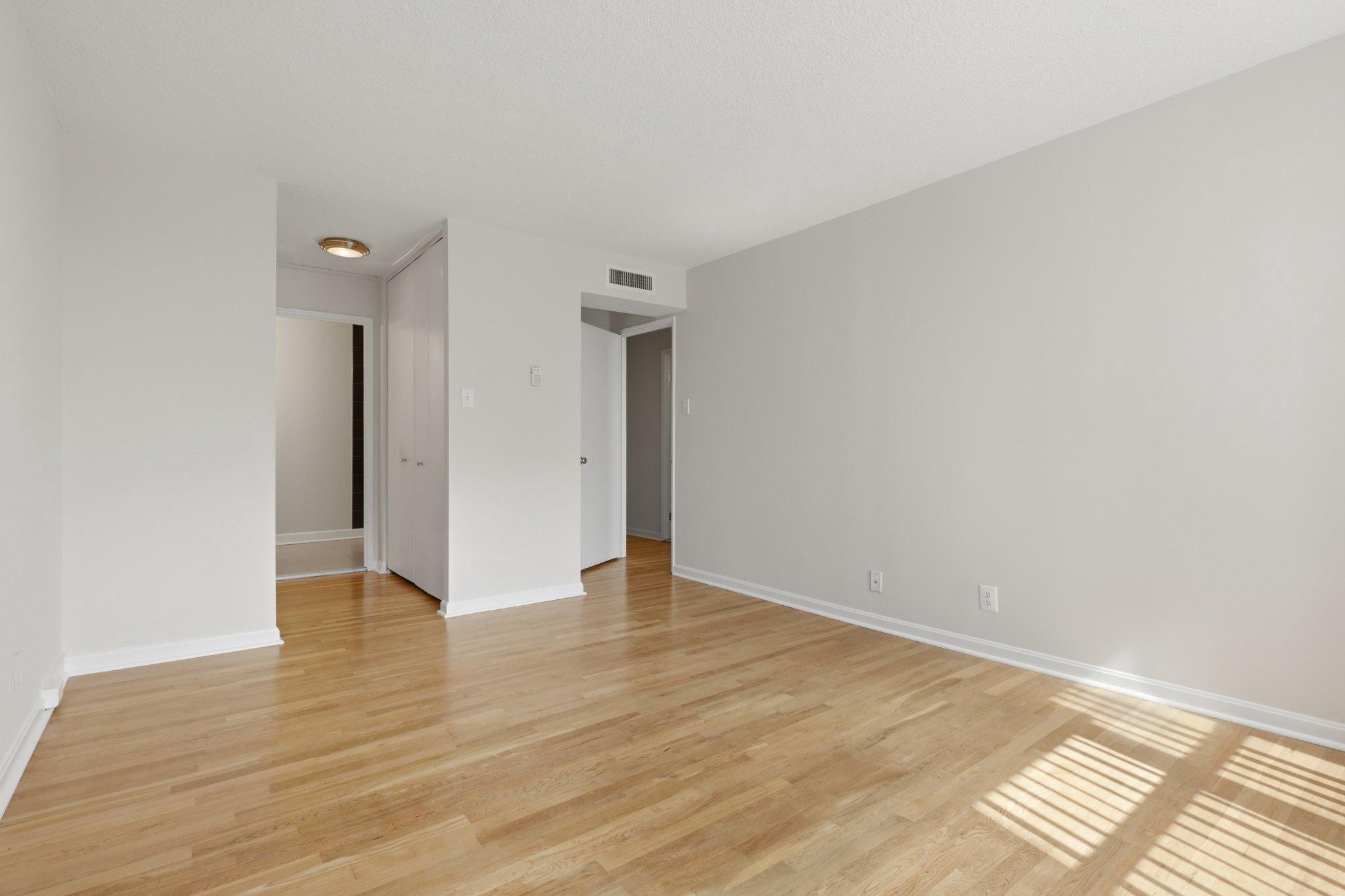 1101 St Paul Street, Unit 1212 Baltimore, MD 21202 - Photo 32 of 36 Master bedroom with spacious closets to en suite.