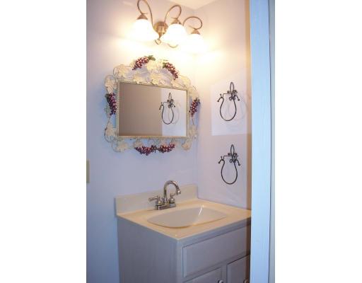 61 Bullivant Farm Road Marion, MA 02738 - Photo 4 of 14 a bathroom with a sink and mirror