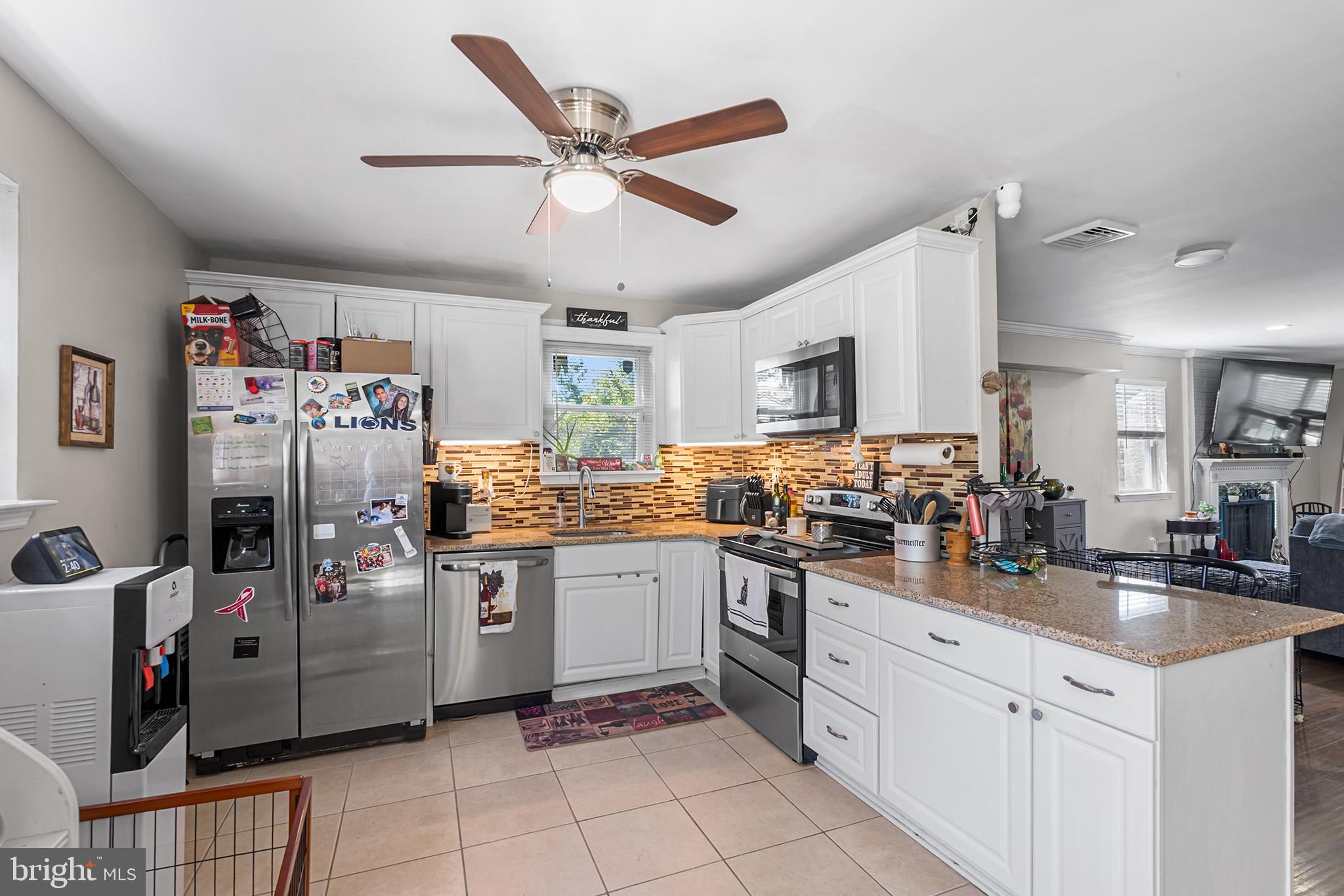 3808 Walnut Ridge Estate Pottstown, PA 19464 - Photo 12 of 30 a kitchen with stainless steel appliances and white cabinets