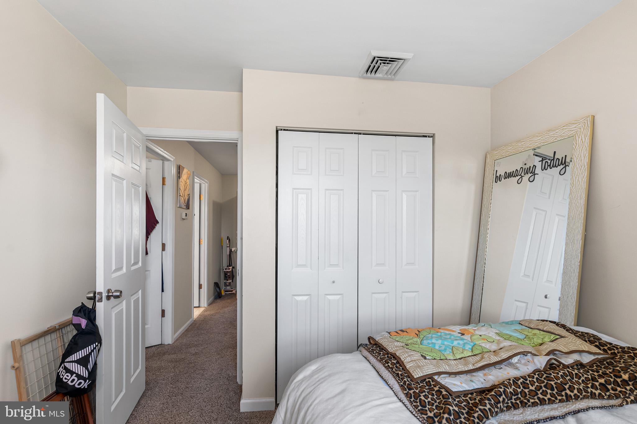 3808 Walnut Ridge Estate Pottstown, PA 19464 - Photo 15 of 30 a bedroom with a bed and a chandelier